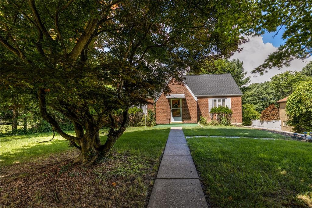 a front view of a house with yard