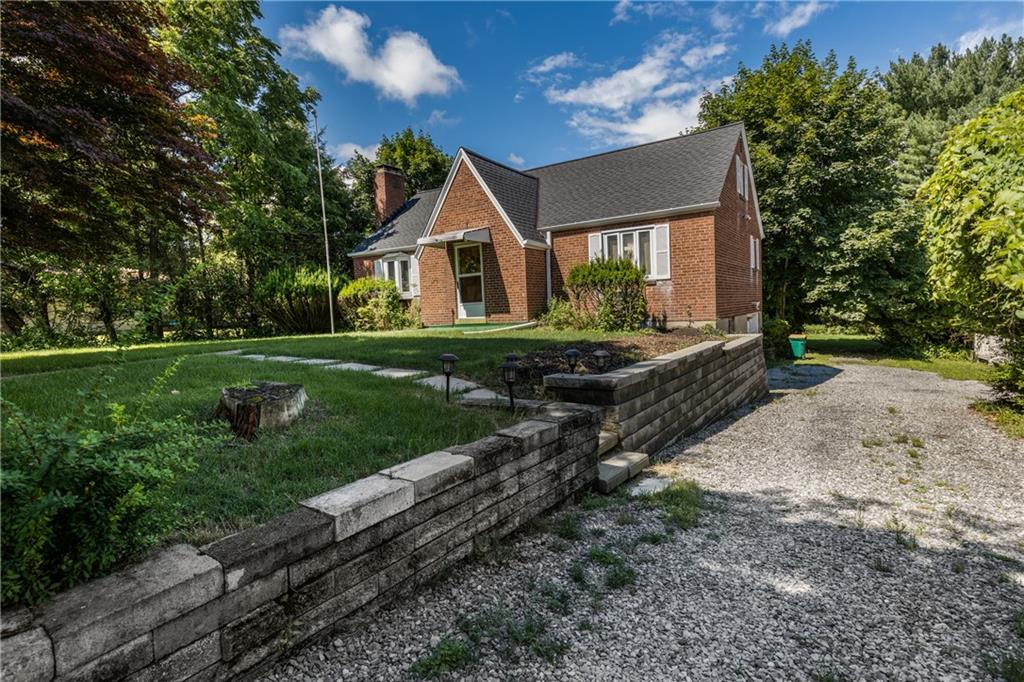 351 Goldsmith Road Pittsburgh, PA 15237 - Photo 2 of 25 a front view of a house with garden