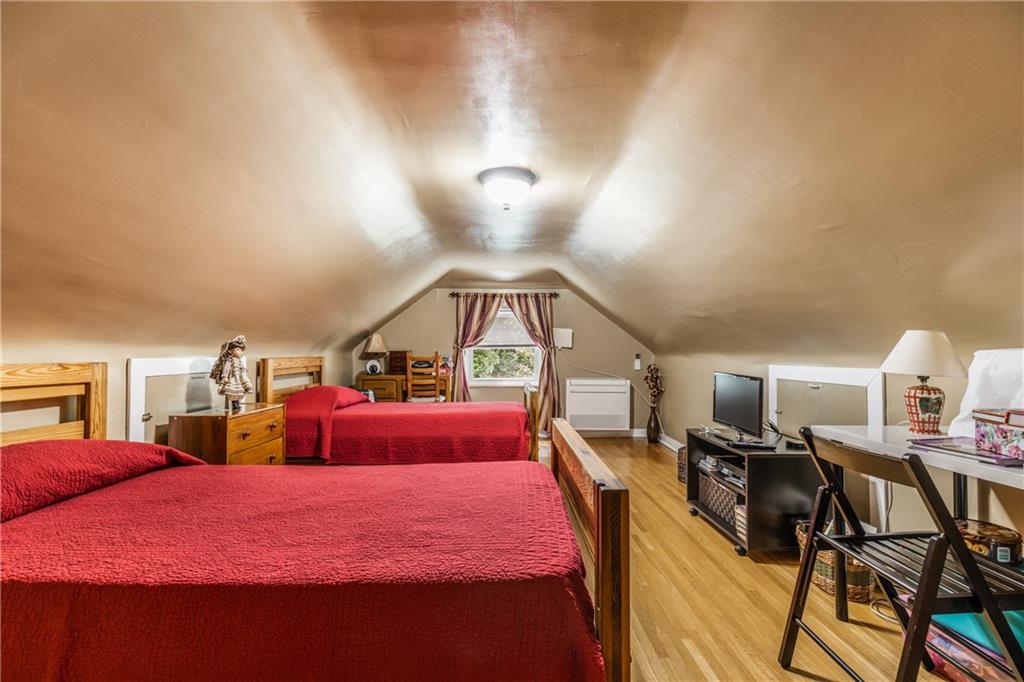 351 Goldsmith Road Pittsburgh, PA 15237 - Photo 18 of 25 a bedroom with a bed and wooden floor