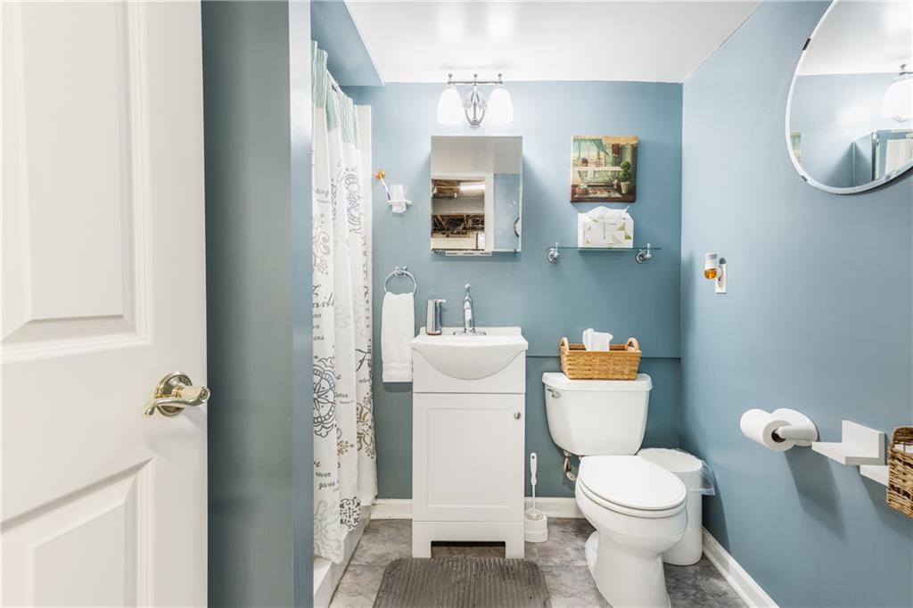 351 Goldsmith Road Pittsburgh, PA 15237 - Photo 21 of 25 a white toilet sitting next to a bathroom sink