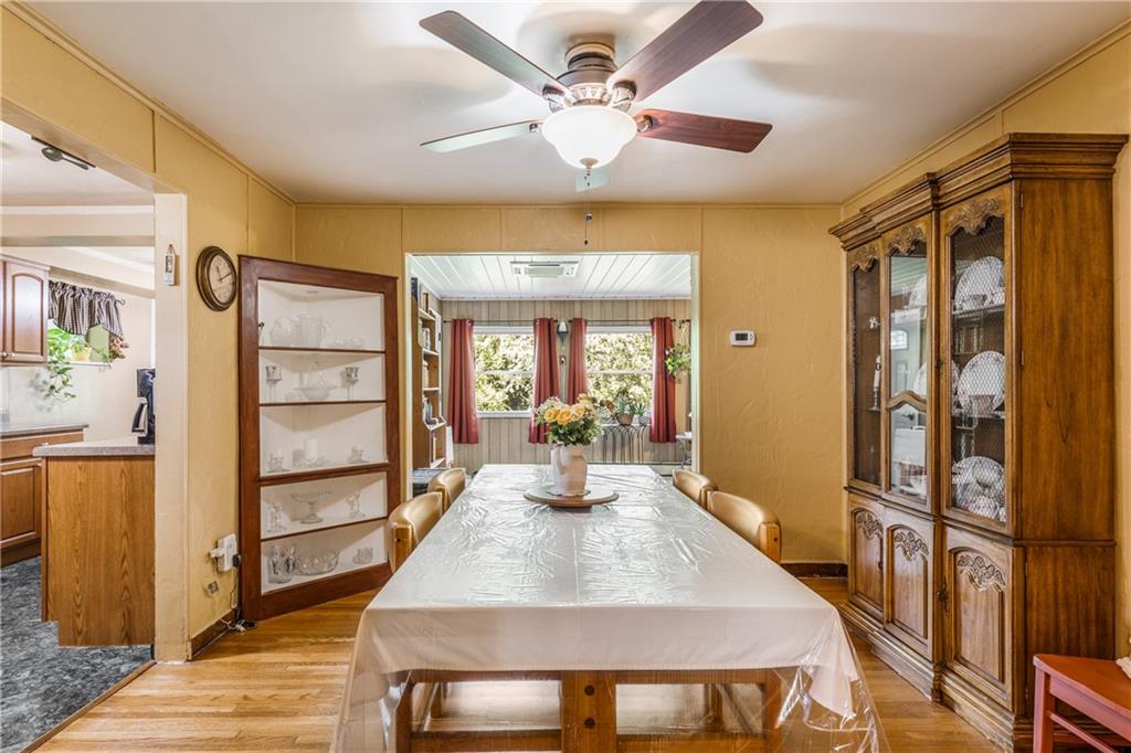 351 Goldsmith Road Pittsburgh, PA 15237 - Photo 7 of 25 a dining room with wooden floor and large window