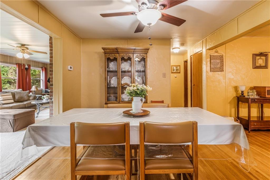 351 Goldsmith Road Pittsburgh, PA 15237 - Photo 8 of 25 a view of a dining room with furniture and wooden floor