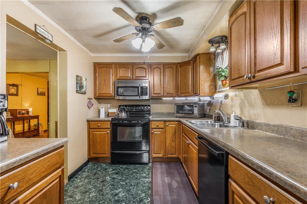 351 Goldsmith Road Pittsburgh, PA 15237 - Photo 10 of 25 a kitchen with granite countertop a sink a counter top space appliances and cabinets