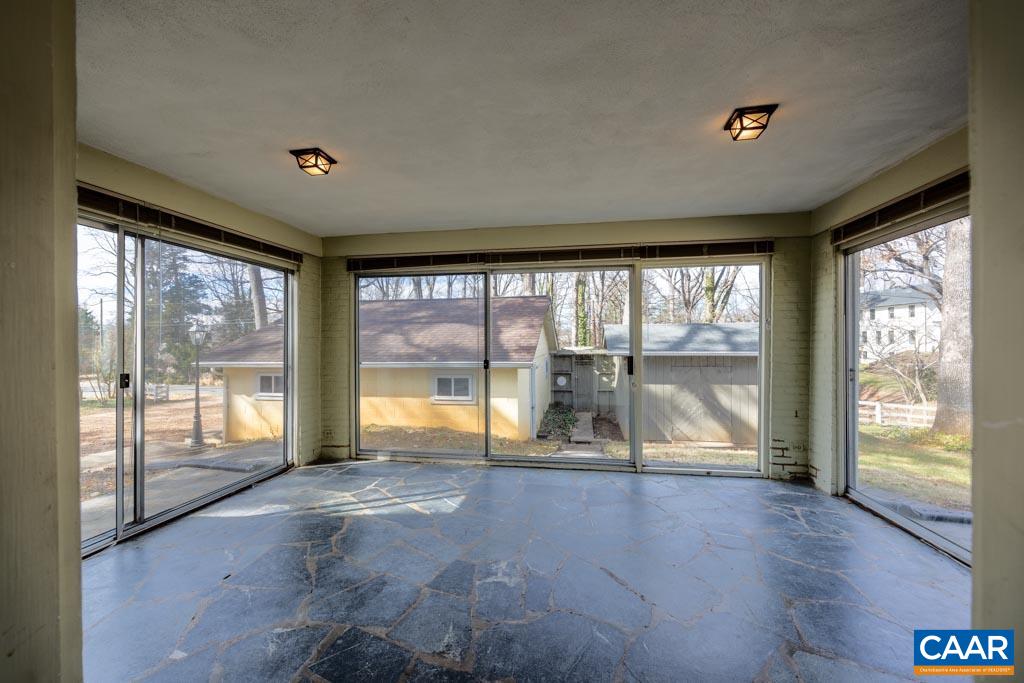 1644 St Annes Road Charlottesville, VA 22901 - Photo 12 of 58 a view of an empty room with wooden floor and a large window