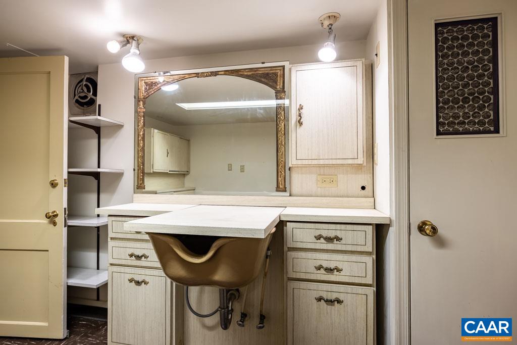 1644 St Annes Road Charlottesville, VA 22901 - Photo 35 of 58 a bathroom with a sink a toilet and mirror