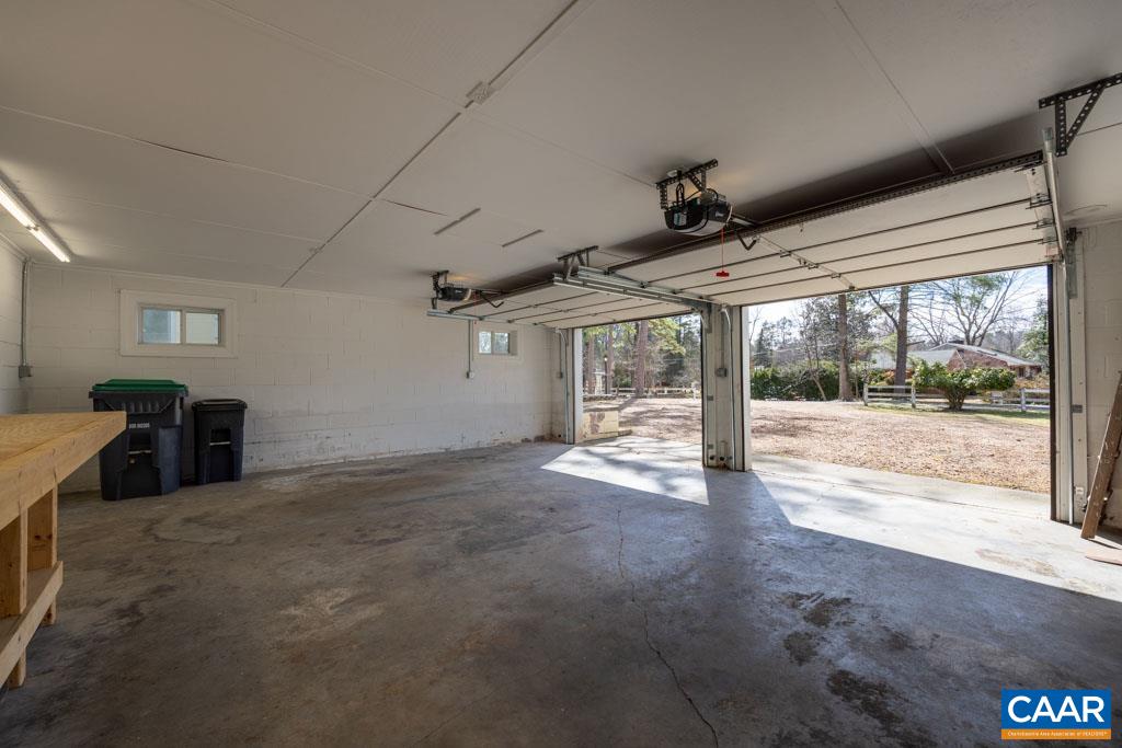 1644 St Annes Road Charlottesville, VA 22901 - Photo 38 of 58 a view of a big room with wooden floor and windows