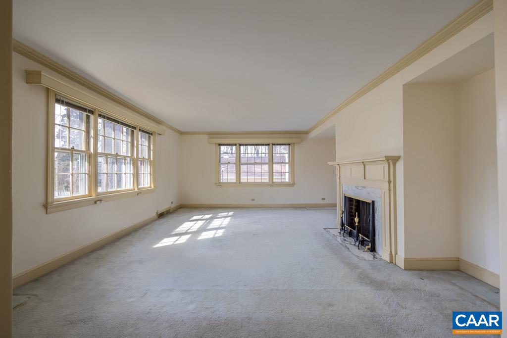 1644 St Annes Road Charlottesville, VA 22901 - Photo 8 of 58 an empty room with fireplace and windows