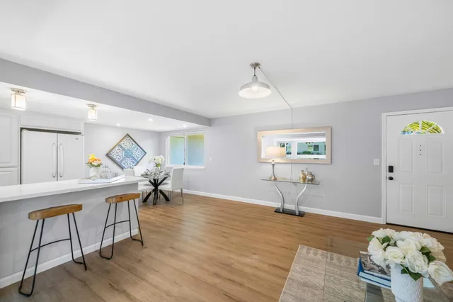 a view of a livingroom with furniture and a window
