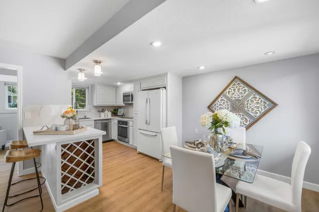 a view of a dining room with furniture and wooden floor