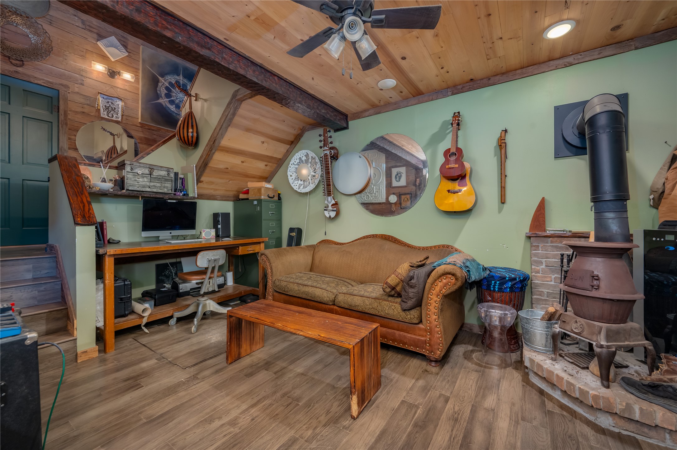 270 Dry Creek Road Manor, TX 78653 - Photo 34 of 40 A welcoming living space features warm wood ceilings, exposed beams, and durable flooring.