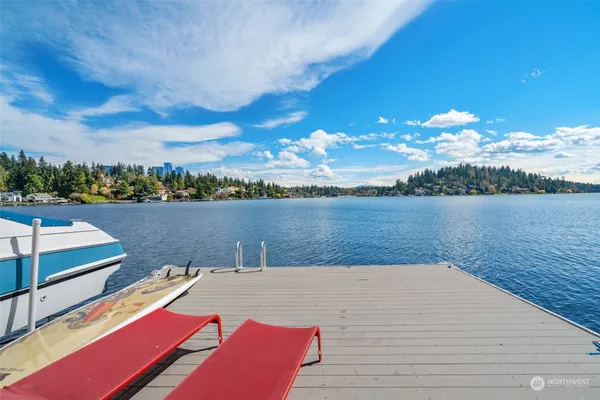 a view of a lake with houses in the back