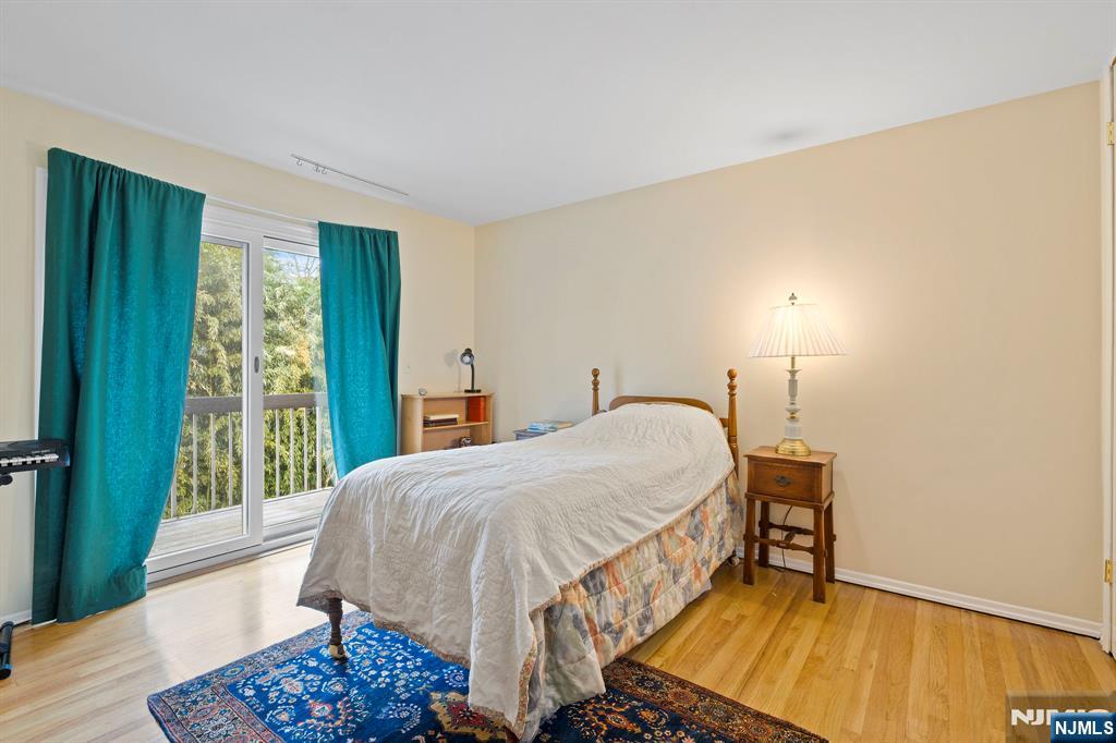 39 Harrison Avenue, Unit 8 Montclair, NJ 07042 - Photo 11 of 19 a bed sitting in a bedroom next to a window