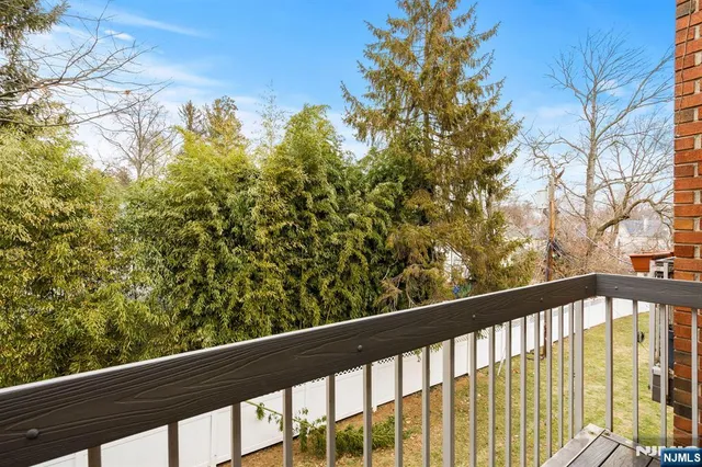 a view of a balcony with a pot