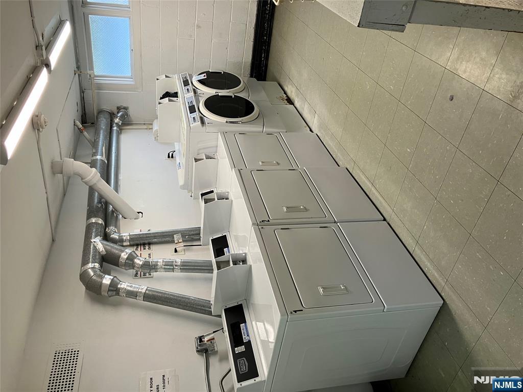 39 Harrison Avenue, Unit 8 Montclair, NJ 07042 - Photo 15 of 19 a utility room with dryer and washer