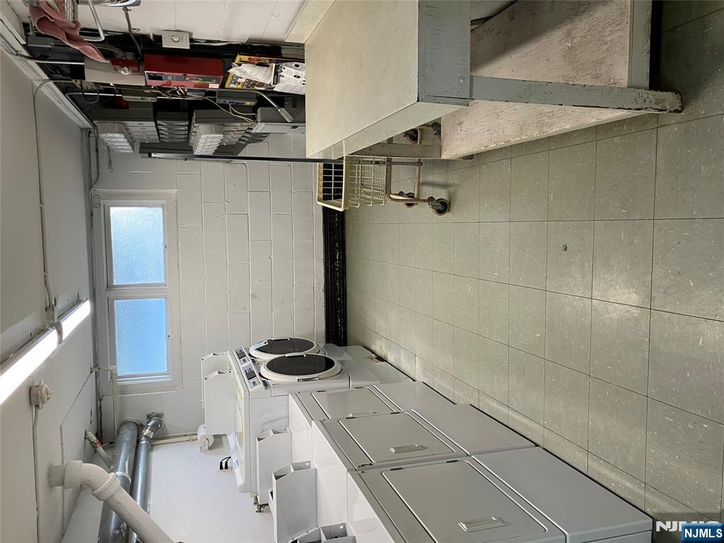 39 Harrison Avenue, Unit 8 Montclair, NJ 07042 - Photo 17 of 19 a view of a storage & utility room with two washing machine