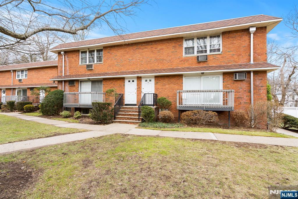 39 Harrison Avenue, Unit 8 Montclair, NJ 07042 - Photo 2 of 19 a front view of a house with a yard