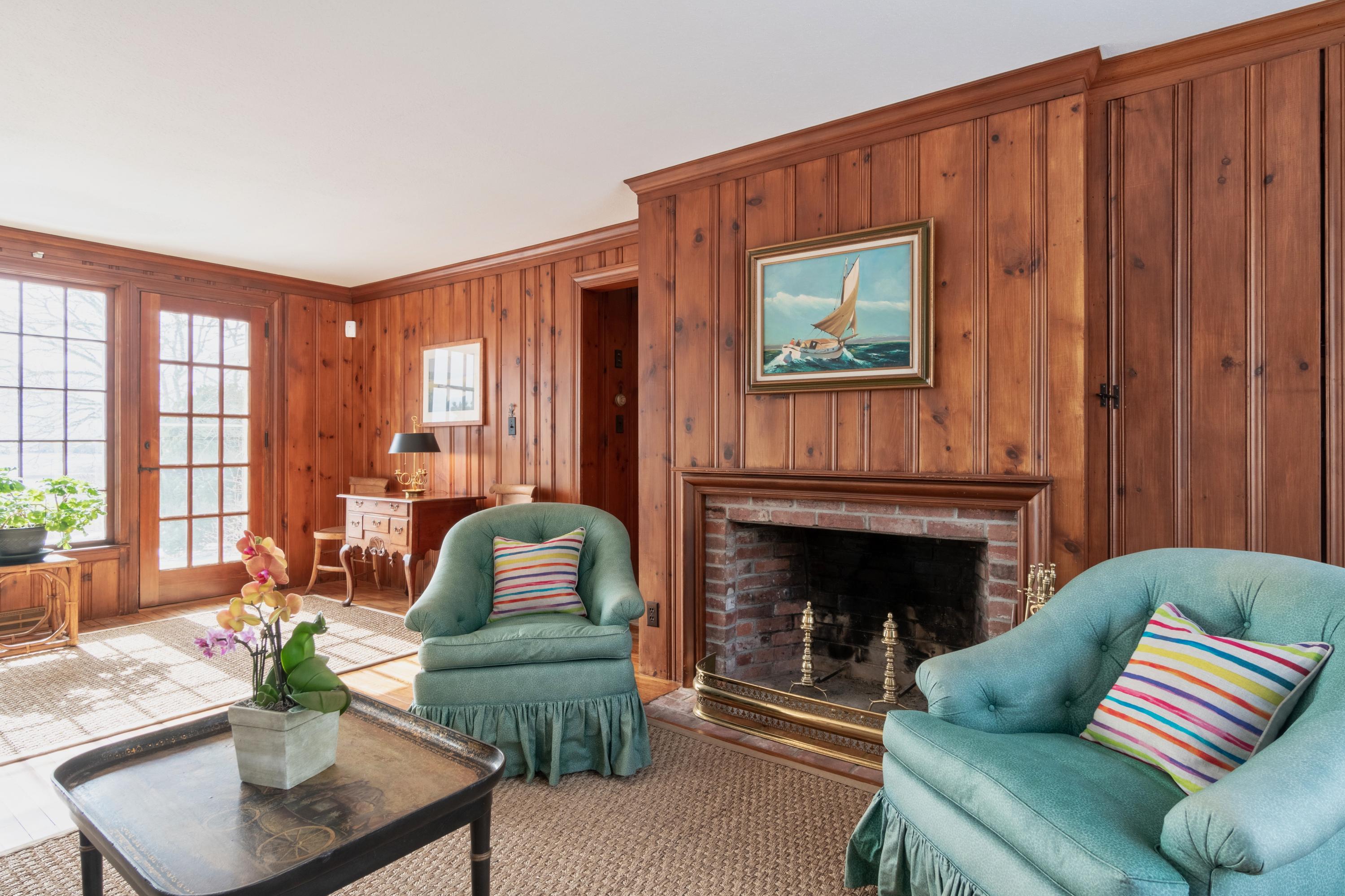 70 Inlet Road Chatham, MA 02633 - Photo 13 of 35 a living room with furniture and a fireplace