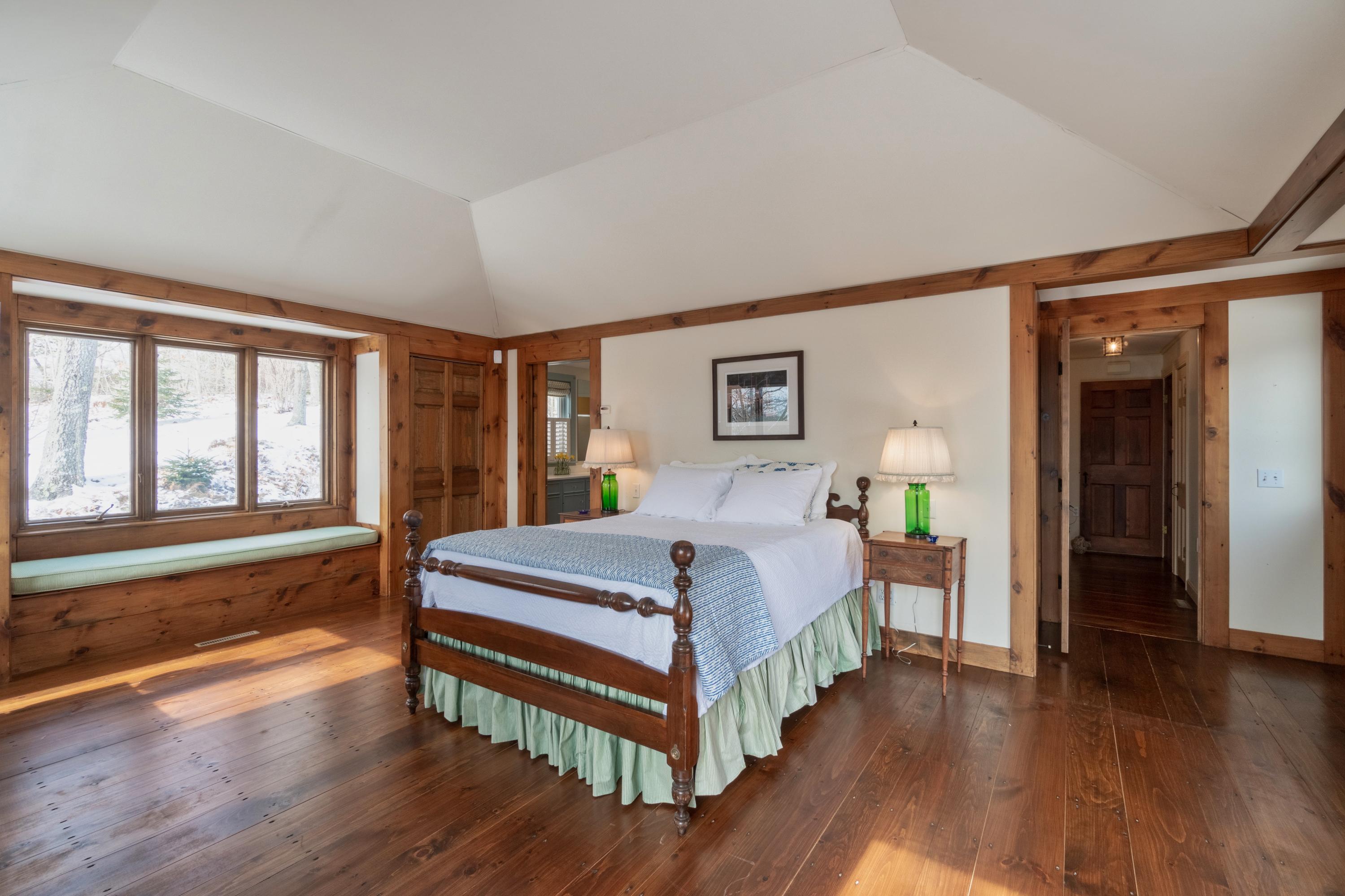 70 Inlet Road Chatham, MA 02633 - Photo 16 of 35 a spacious bedroom with a bed and a large window