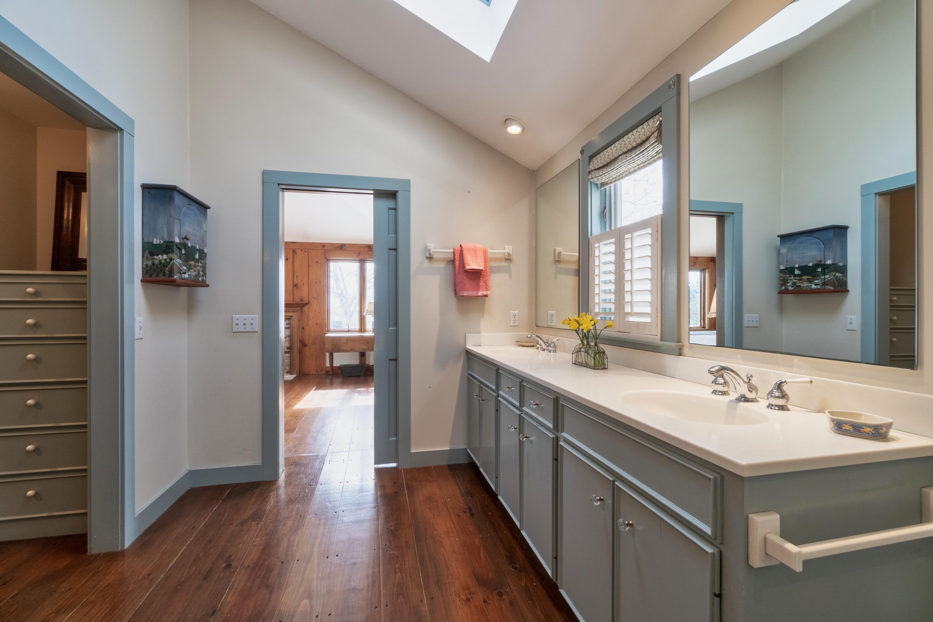 70 Inlet Road Chatham, MA 02633 - Photo 18 of 35 a bathroom with a sink mirror and a shower