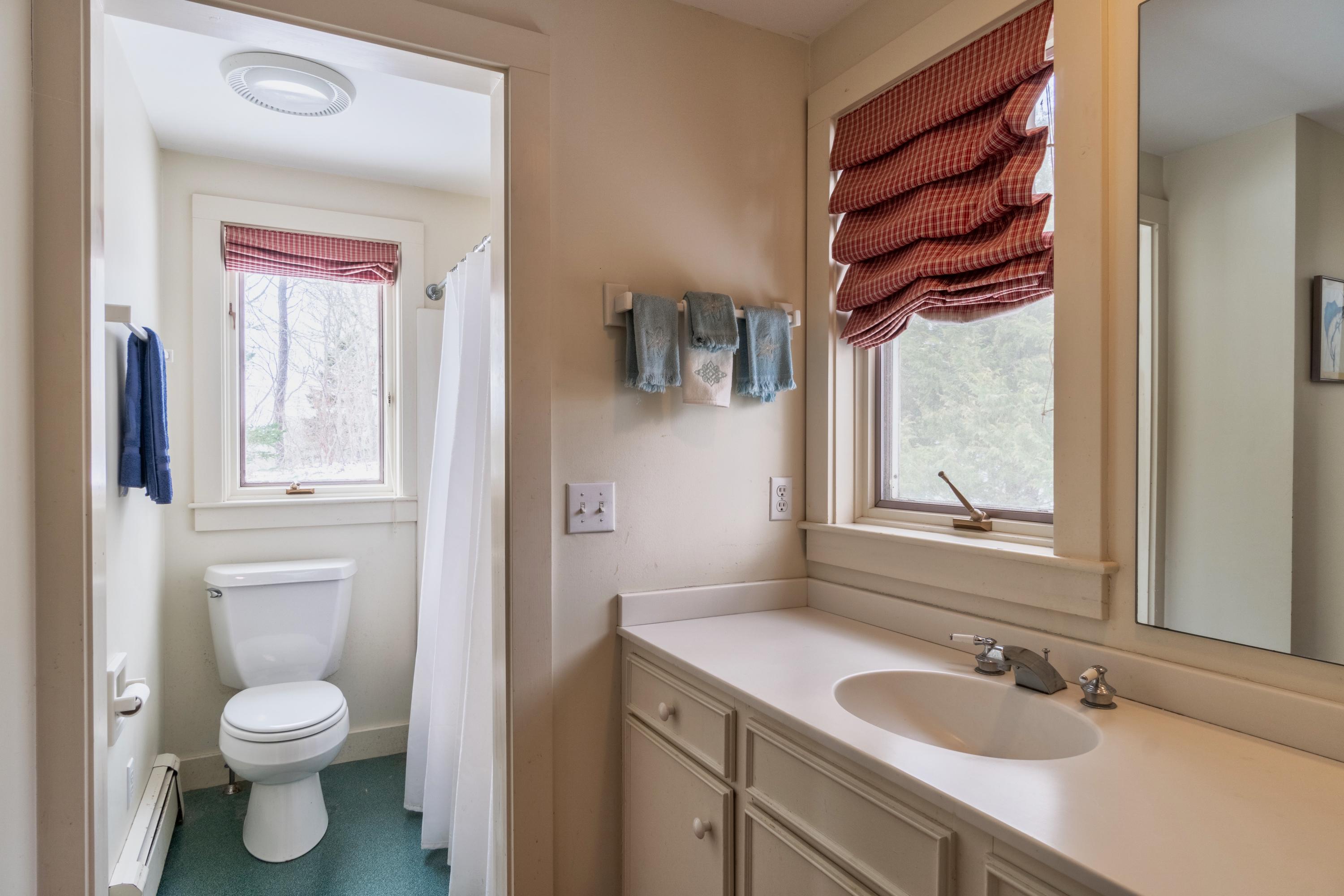 70 Inlet Road Chatham, MA 02633 - Photo 25 of 35 a bathroom with a toilet sink and mirror