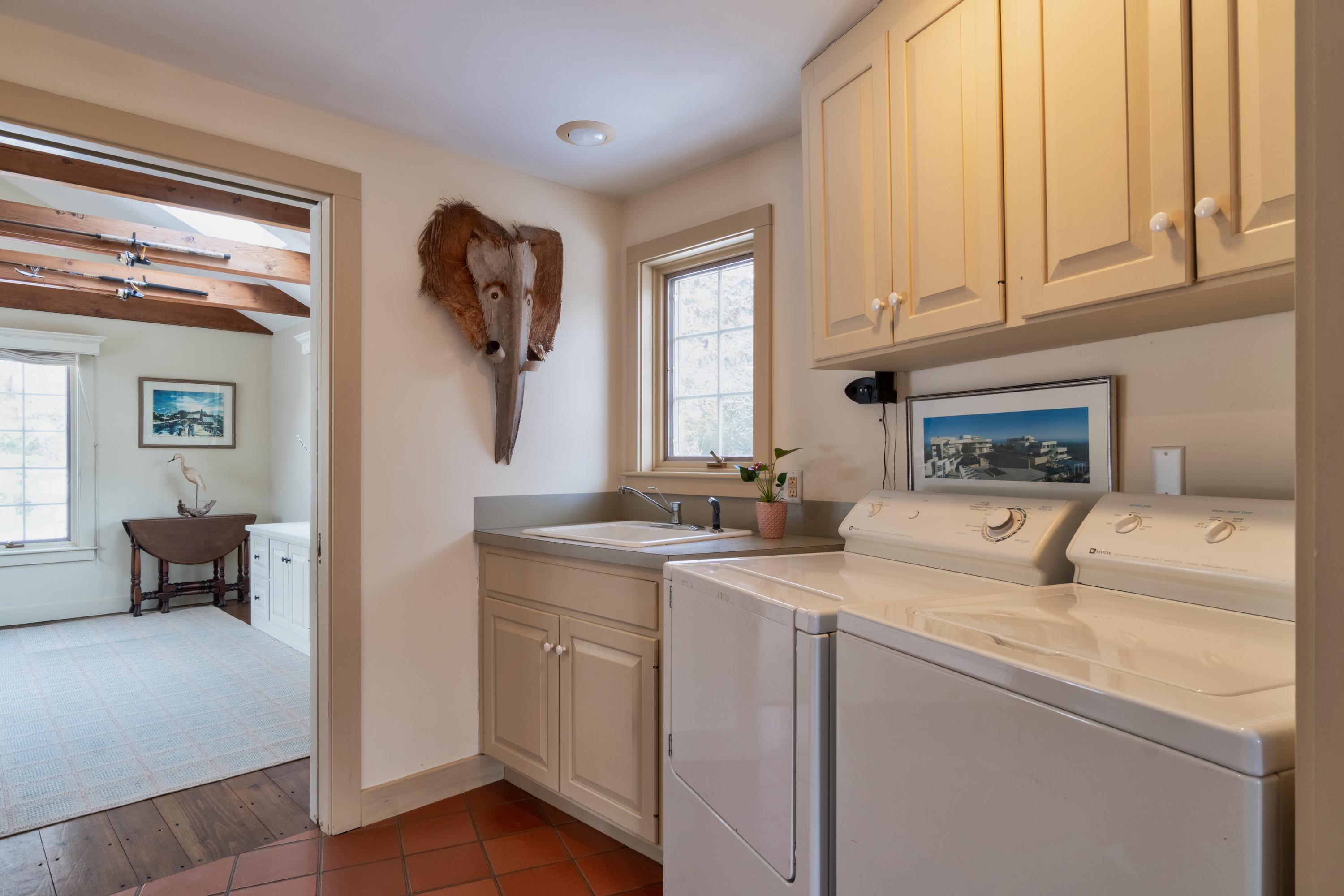 70 Inlet Road Chatham, MA 02633 - Photo 28 of 35 a kitchen with a sink and cabinets