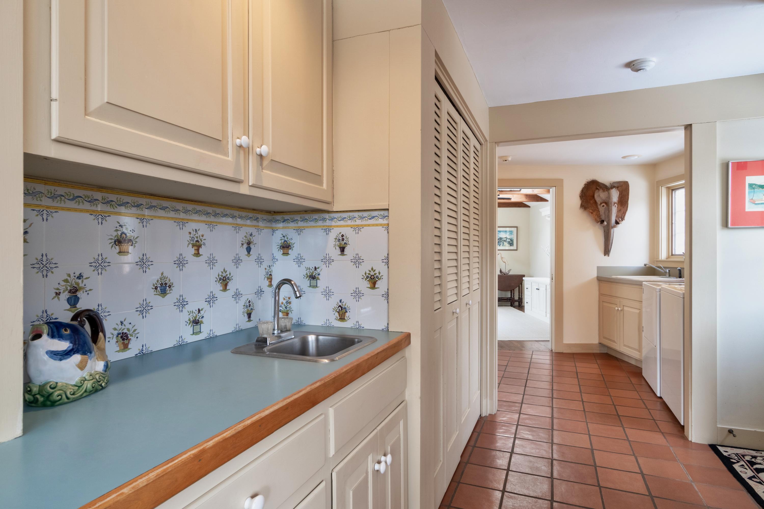 70 Inlet Road Chatham, MA 02633 - Photo 29 of 35 a kitchen with stainless steel appliances granite countertop a refrigerator and white cabinets