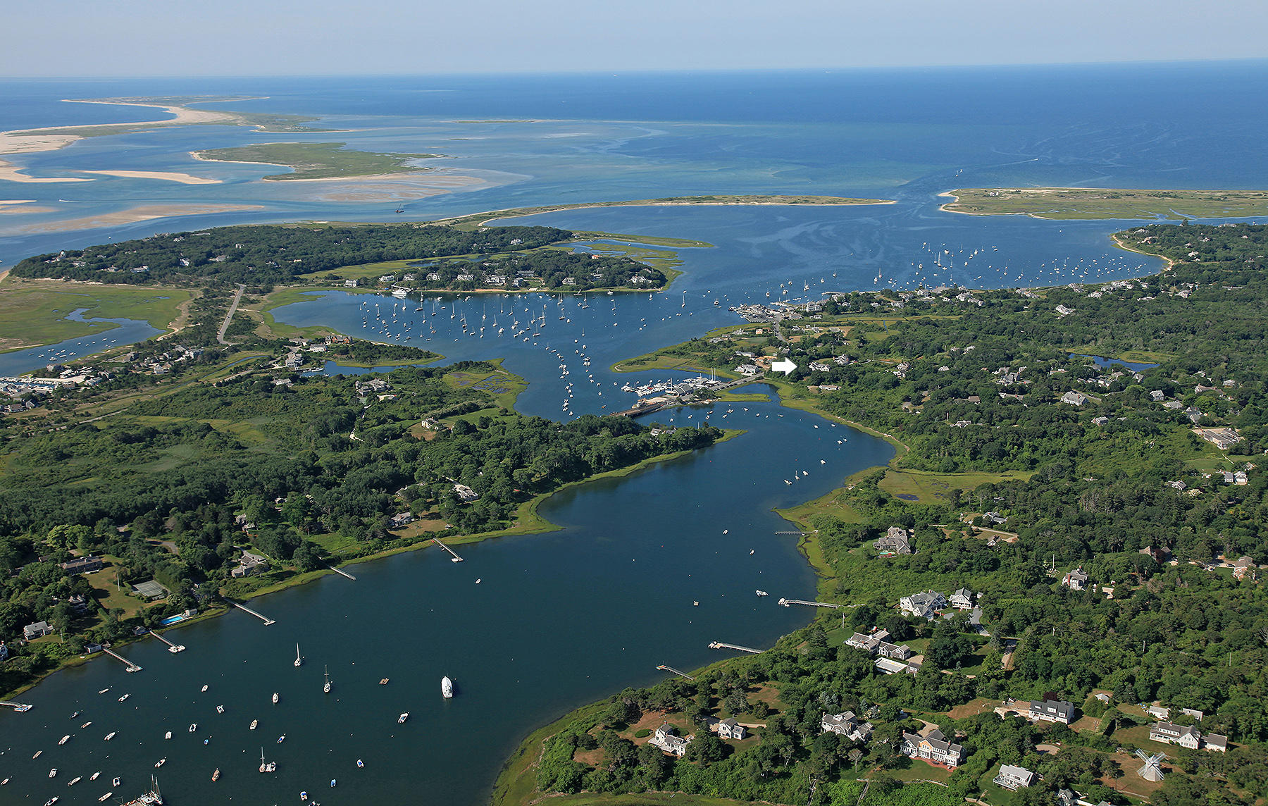 70 Inlet Road Chatham, MA 02633 - Photo 3 of 35 an aerial view of ocean and residential houses with outdoor space