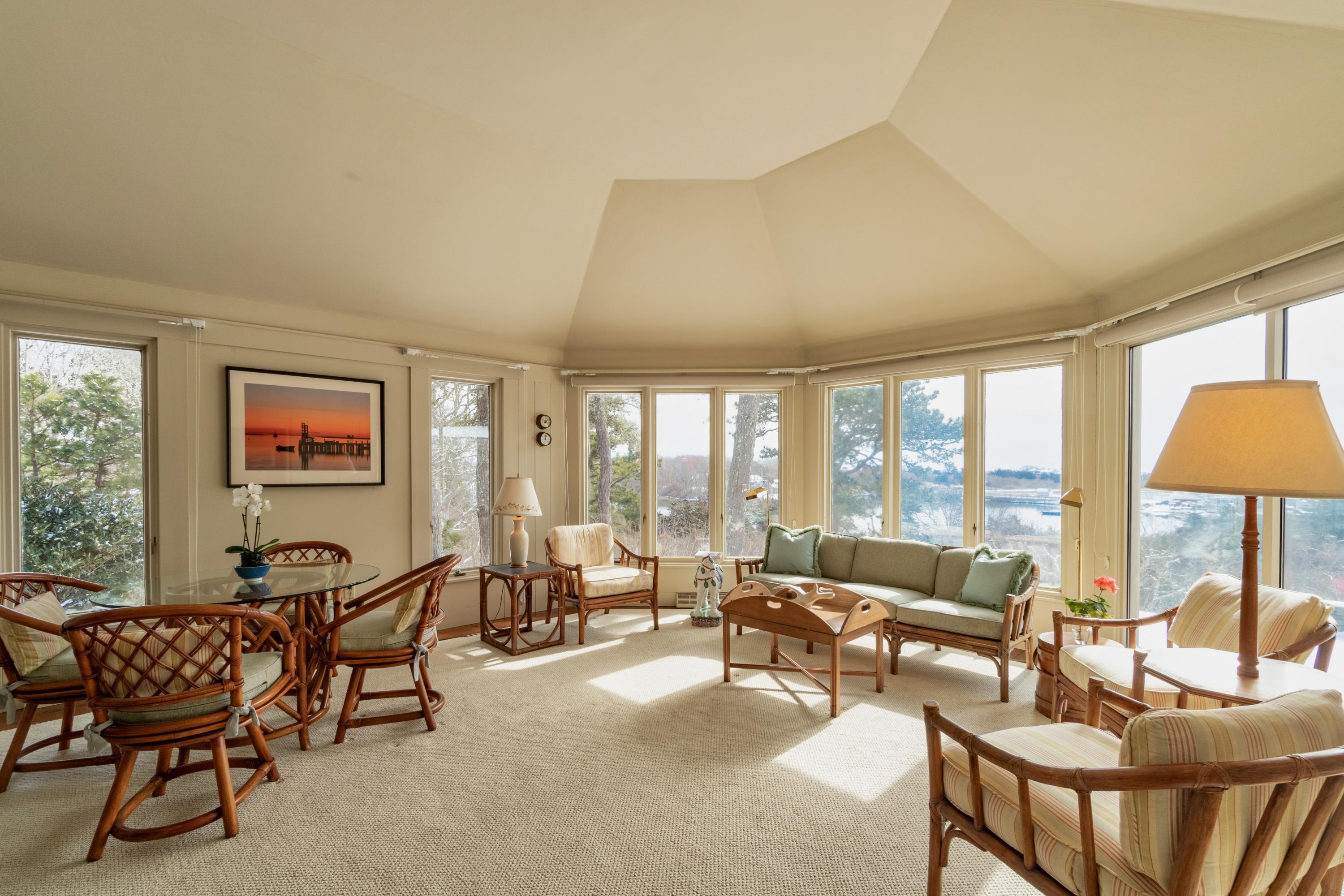 70 Inlet Road Chatham, MA 02633 - Photo 8 of 35 a living room with furniture and a large window