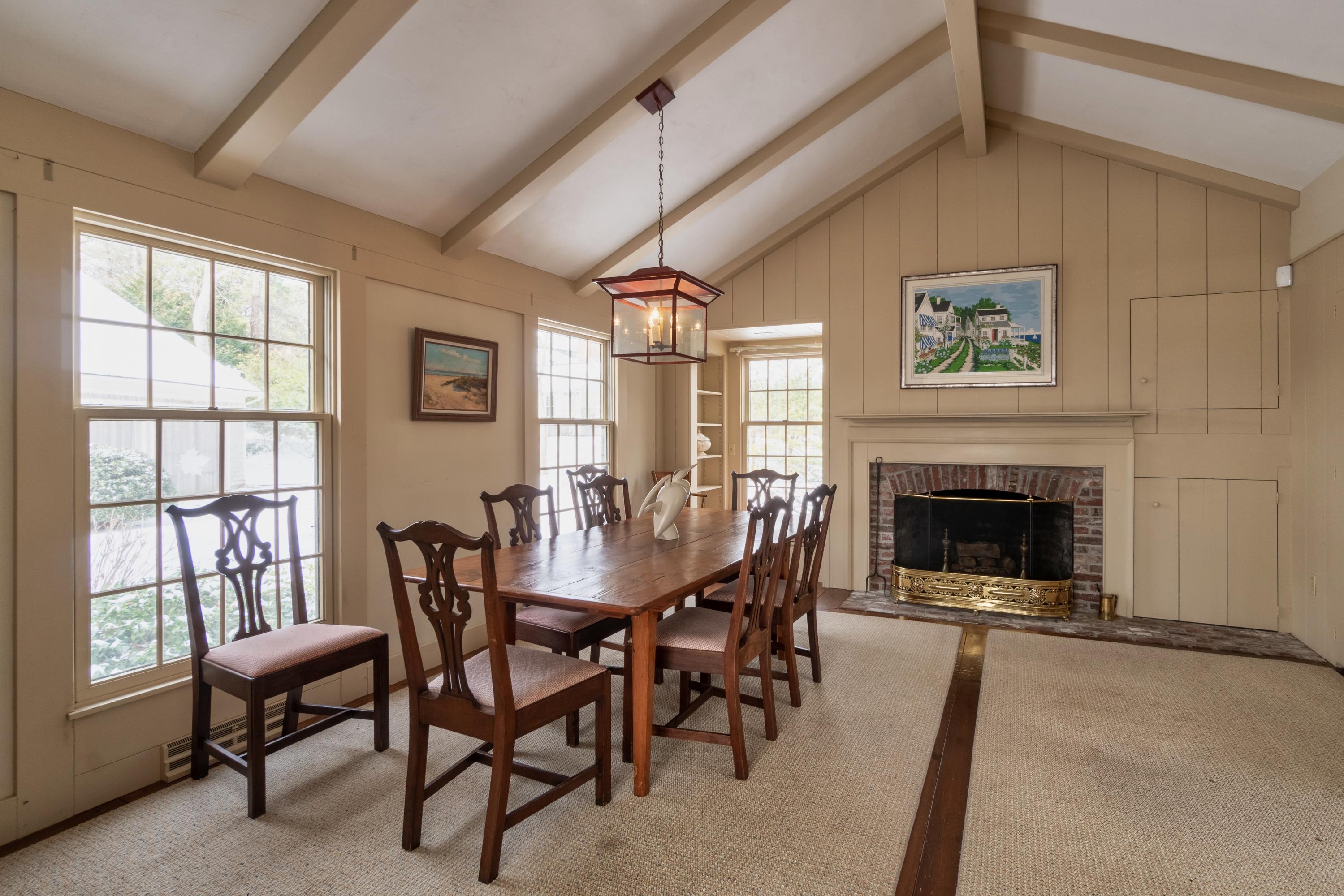 70 Inlet Road Chatham, MA 02633 - Photo 9 of 35 a view of a livingroom with furniture and a fireplace