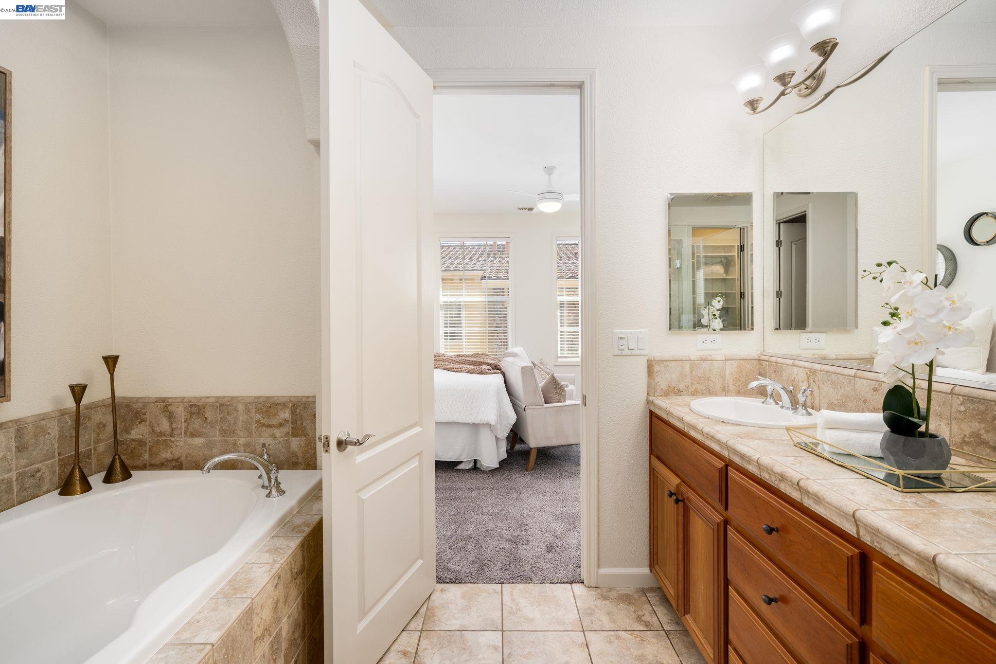 4653 Rimini Court Dublin, CA 94568 - Photo 29 of 44 a spacious bathroom with a tub sink and mirror