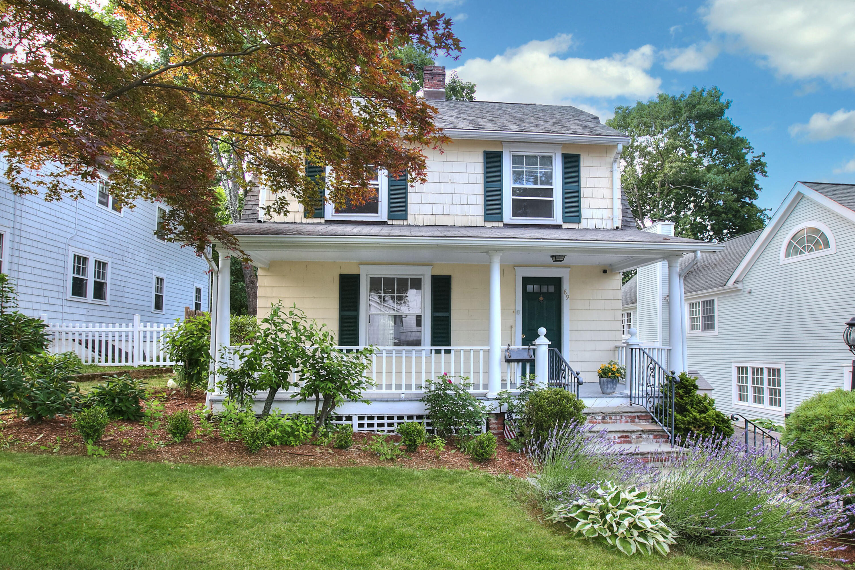 front view of a house with a yard