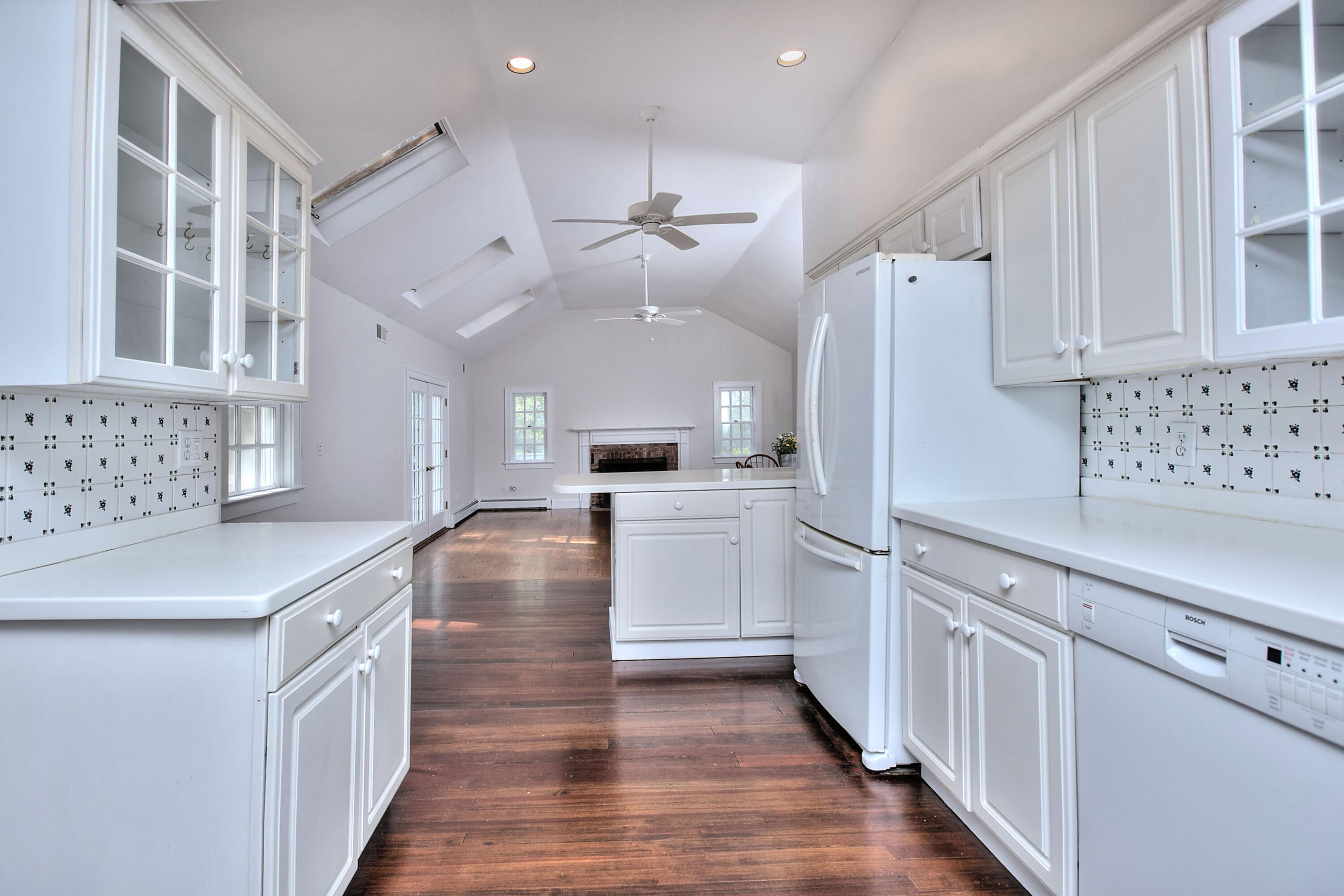 89 Richmond Hill Road New Canaan, CT 06840 - Photo 12 of 40 a kitchen with white cabinets and white appliances