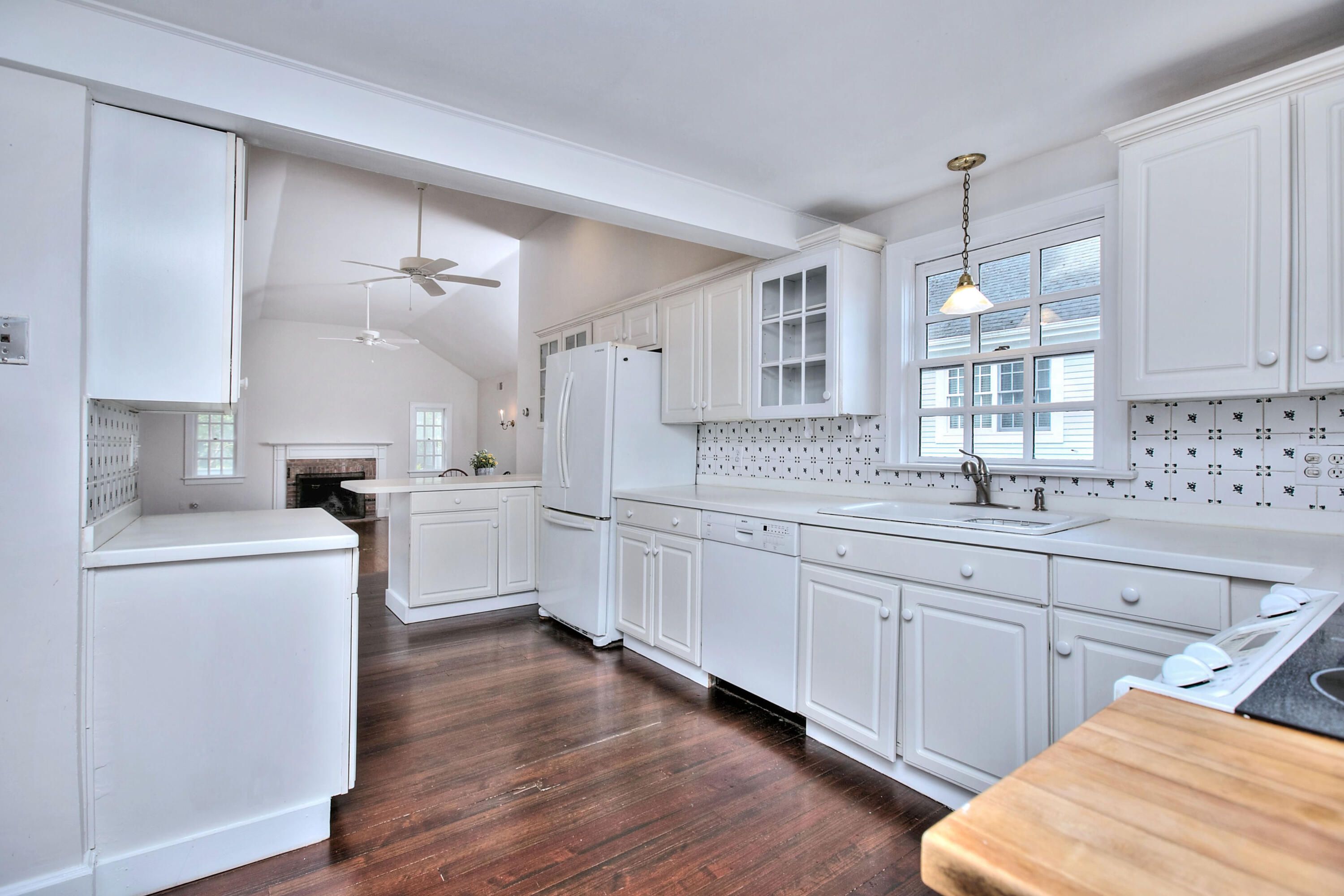 89 Richmond Hill Road New Canaan, CT 06840 - Photo 14 of 40 a kitchen with white cabinets appliances and sink