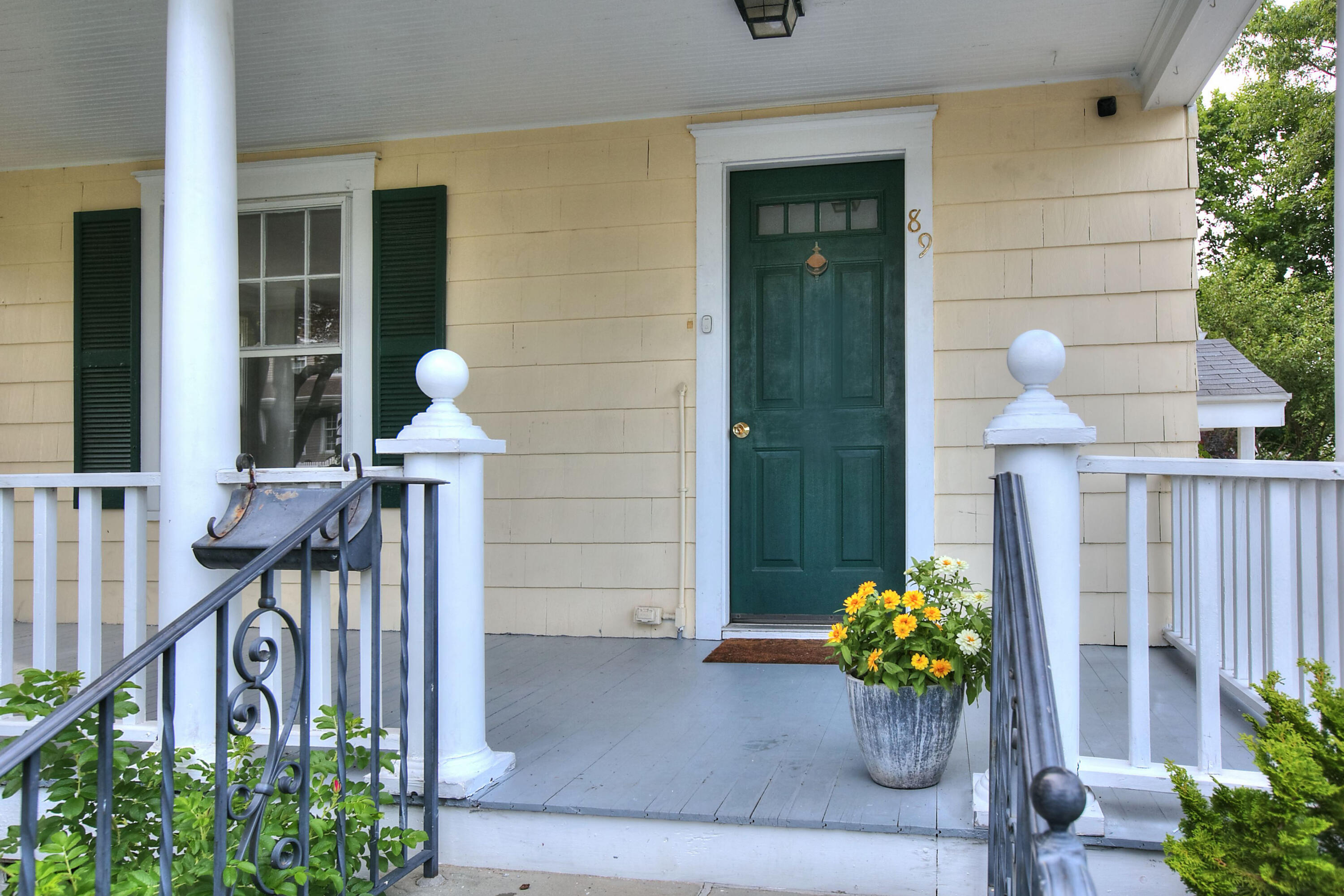 89 Richmond Hill Road New Canaan, CT 06840 - Photo 2 of 40 a front view of a house having patio