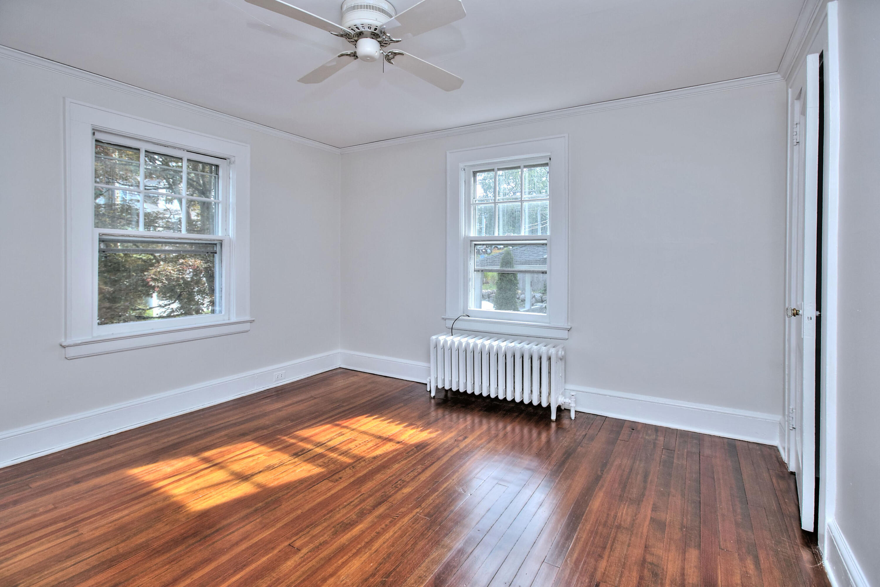 89 Richmond Hill Road New Canaan, CT 06840 - Photo 23 of 40 a view of empty room with wooden floor and fan