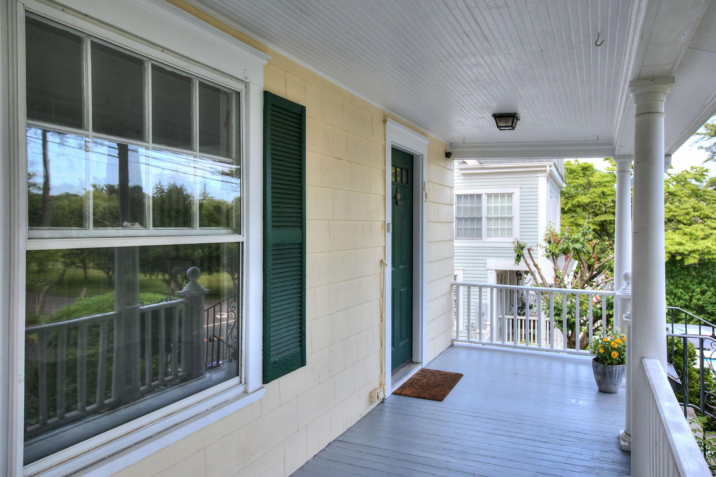 89 Richmond Hill Road New Canaan, CT 06840 - Photo 31 of 40 a view of front door and porch with wooden floor