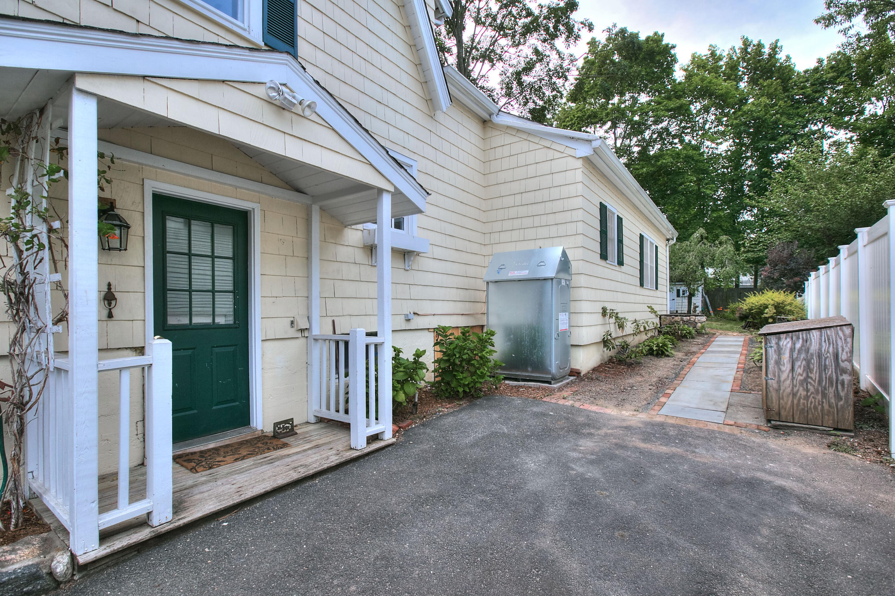 89 Richmond Hill Road New Canaan, CT 06840 - Photo 32 of 40 a view of a house with a yard and garage