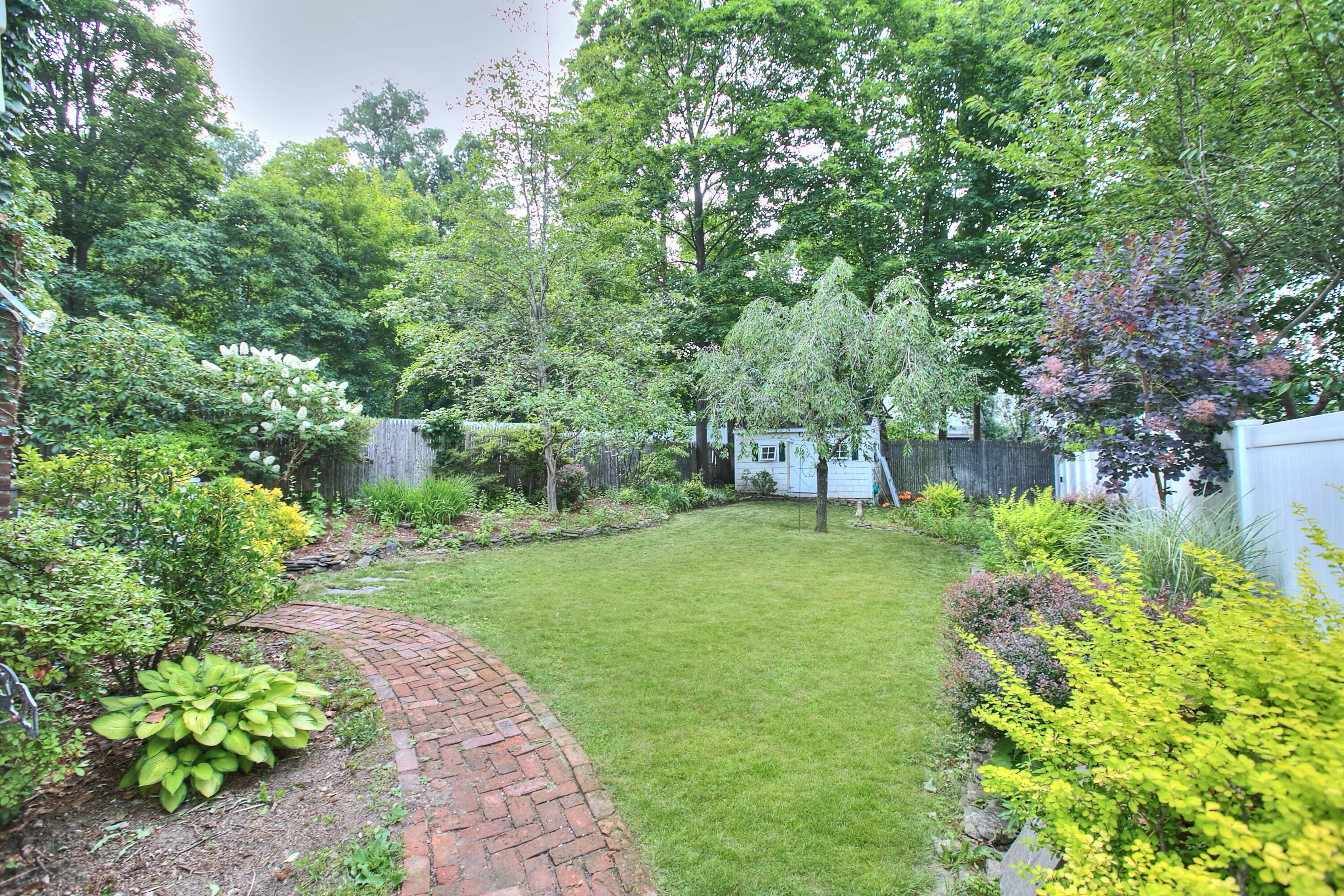 89 Richmond Hill Road New Canaan, CT 06840 - Photo 33 of 40 a view of a yard with a tree