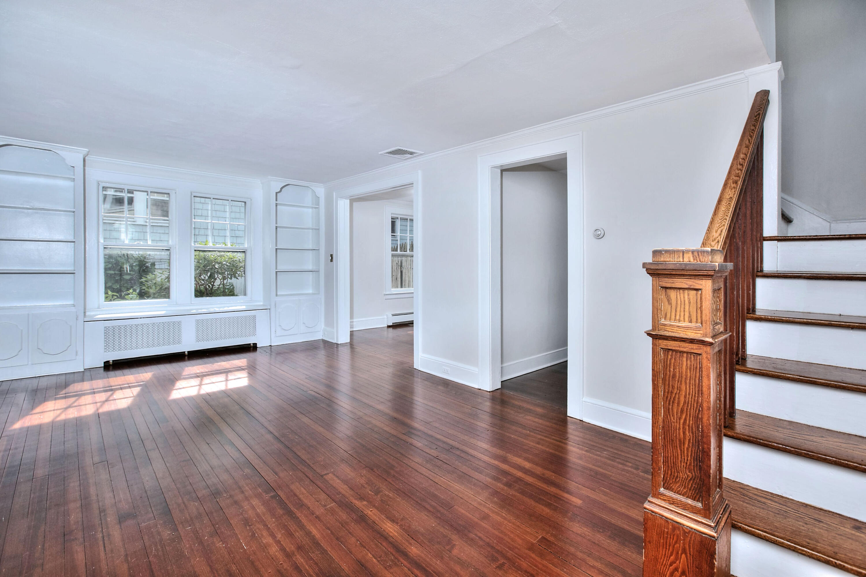 89 Richmond Hill Road New Canaan, CT 06840 - Photo 5 of 40 a view of empty room with wooden floor and fan