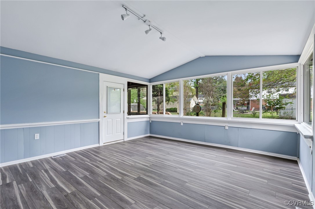 9232 Groomfield Road Chesterfield, VA 23236 - Photo 14 of 50 a view of an empty room with wooden floor and a window