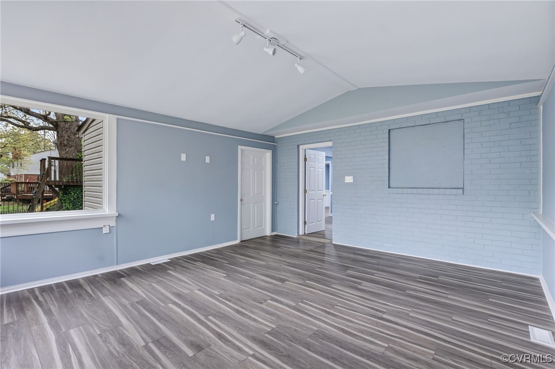 9232 Groomfield Road Chesterfield, VA 23236 - Photo 15 of 50 a view of an empty room with wooden floor and a window