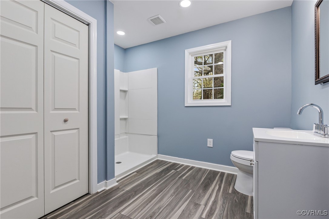 9232 Groomfield Road Chesterfield, VA 23236 - Photo 16 of 50 a view of bathroom with a toilet a sink and a vanity