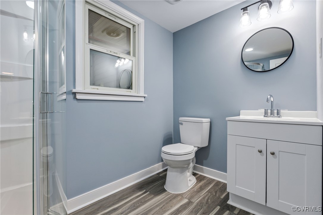 9232 Groomfield Road Chesterfield, VA 23236 - Photo 18 of 50 a bathroom with a sink toilet and a mirror