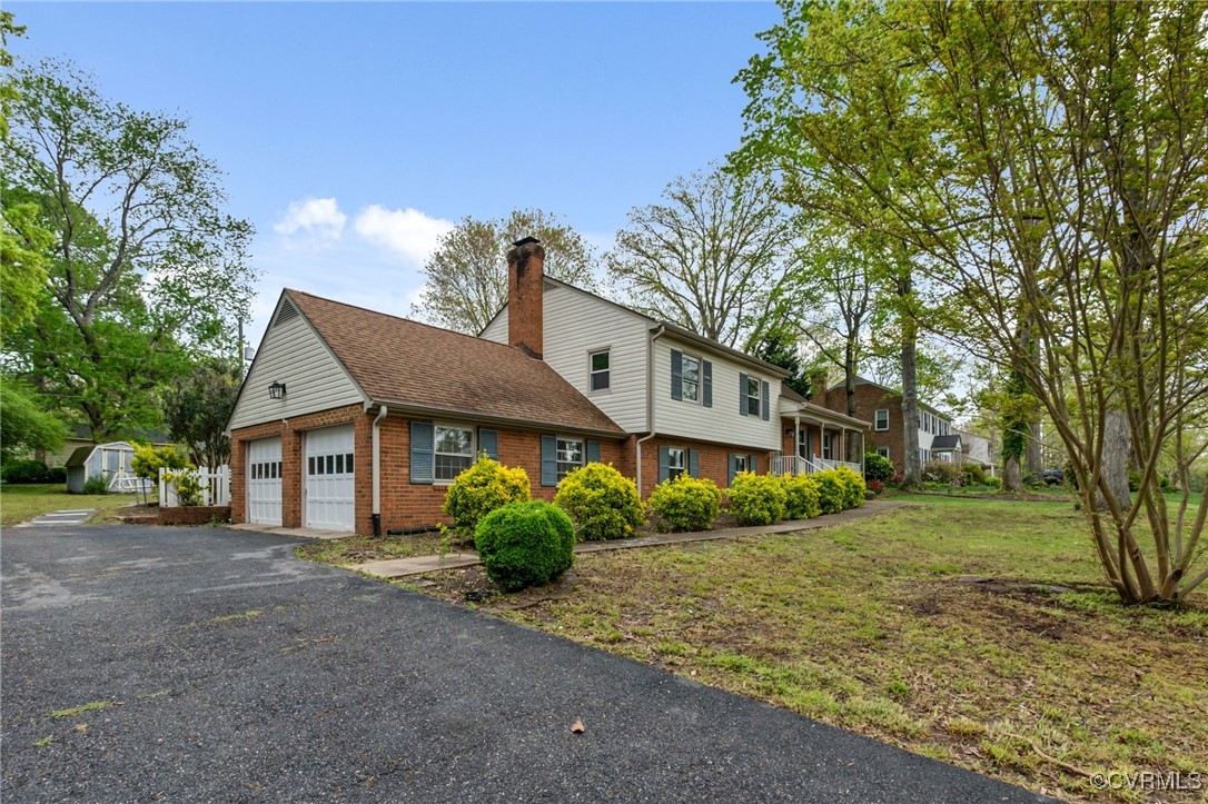 9232 Groomfield Road Chesterfield, VA 23236 - Photo 2 of 50 a house that has a lot of plants in it