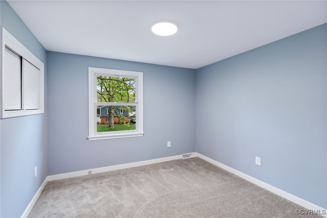 9232 Groomfield Road Chesterfield, VA 23236 - Photo 22 of 50 an empty room with windows