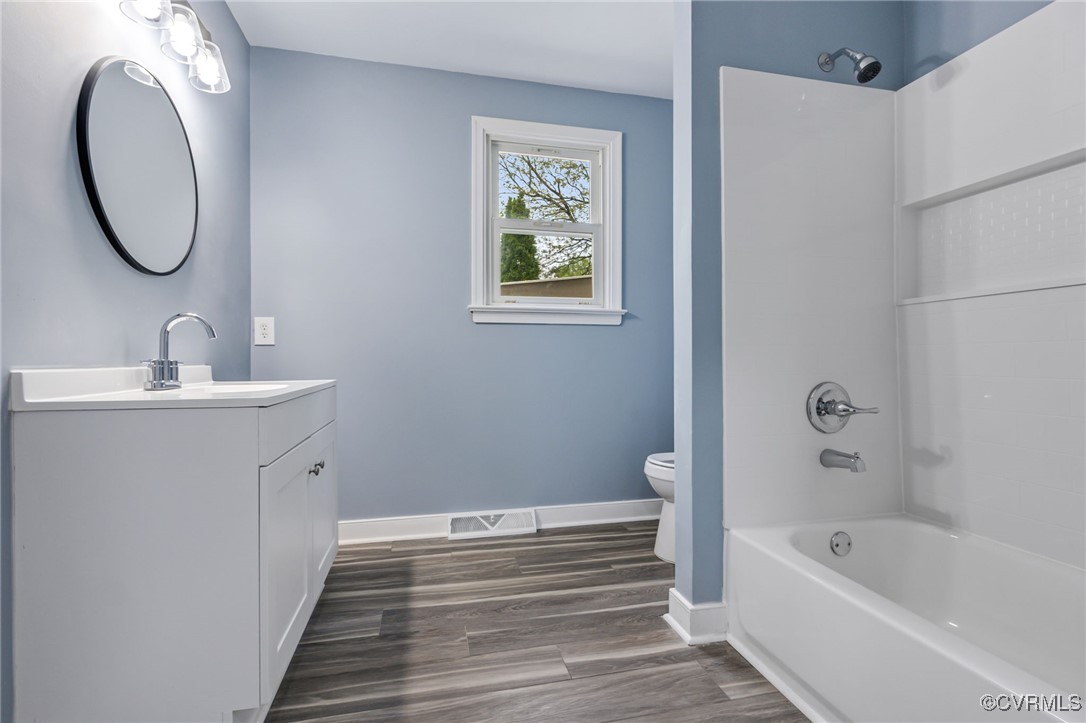 9232 Groomfield Road Chesterfield, VA 23236 - Photo 30 of 50 a bathroom with a tub sink and mirror