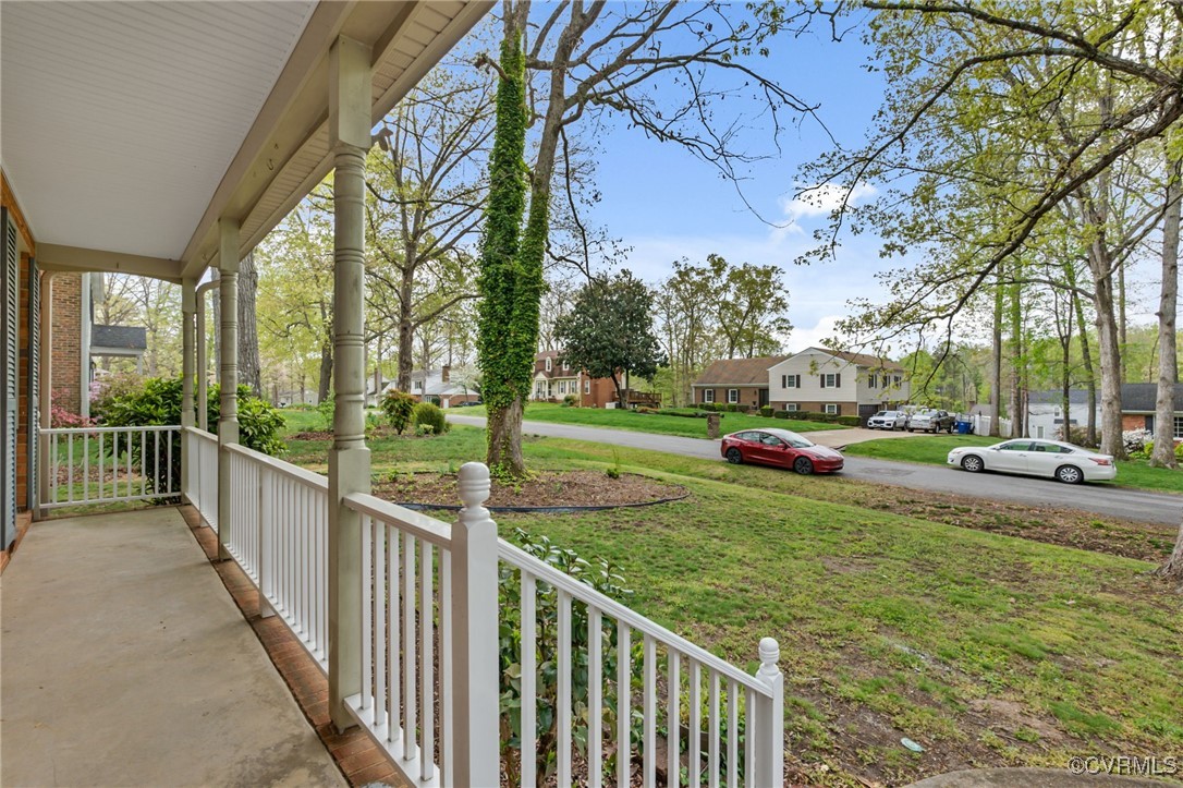 9232 Groomfield Road Chesterfield, VA 23236 - Photo 3 of 50 a view of a house with a small yard and large trees
