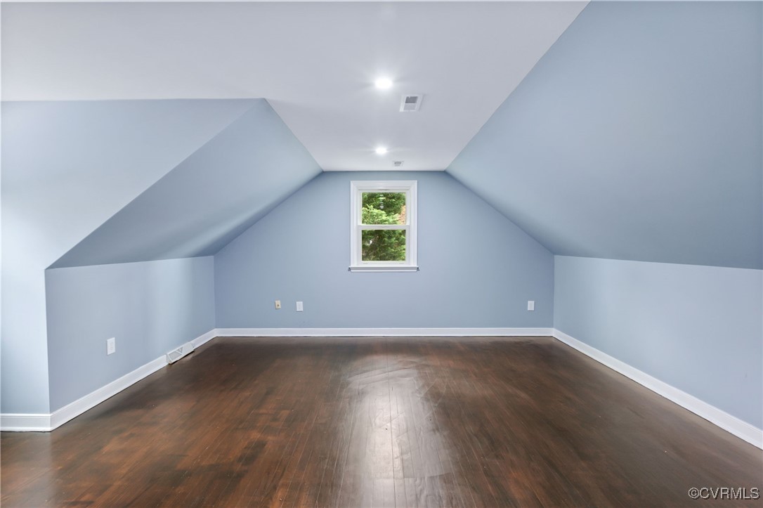9232 Groomfield Road Chesterfield, VA 23236 - Photo 33 of 50 a view of an empty room with wooden floor and a window