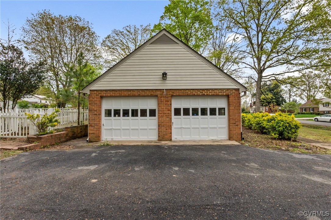 9232 Groomfield Road Chesterfield, VA 23236 - Photo 46 of 50 a view of a house with a large space and a large tree