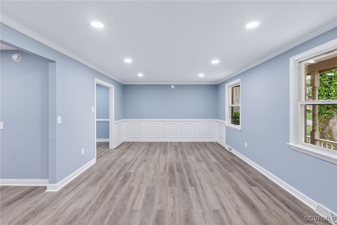 9232 Groomfield Road Chesterfield, VA 23236 - Photo 6 of 50 a view of wooden floor in an empty room with a window